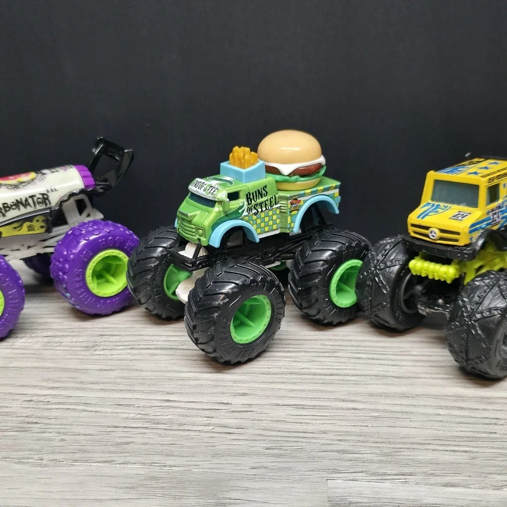 Hotwheels Monster Trucks Lot - Carbonator, Buns Of Steel, Unimog, And Tuk N Roll